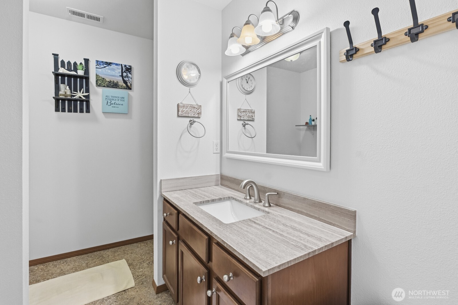 1804 Harborview Drive Aberdeen, WA 98520 - Photo 21 of 30 a bathroom with a sink vanity and a mirror