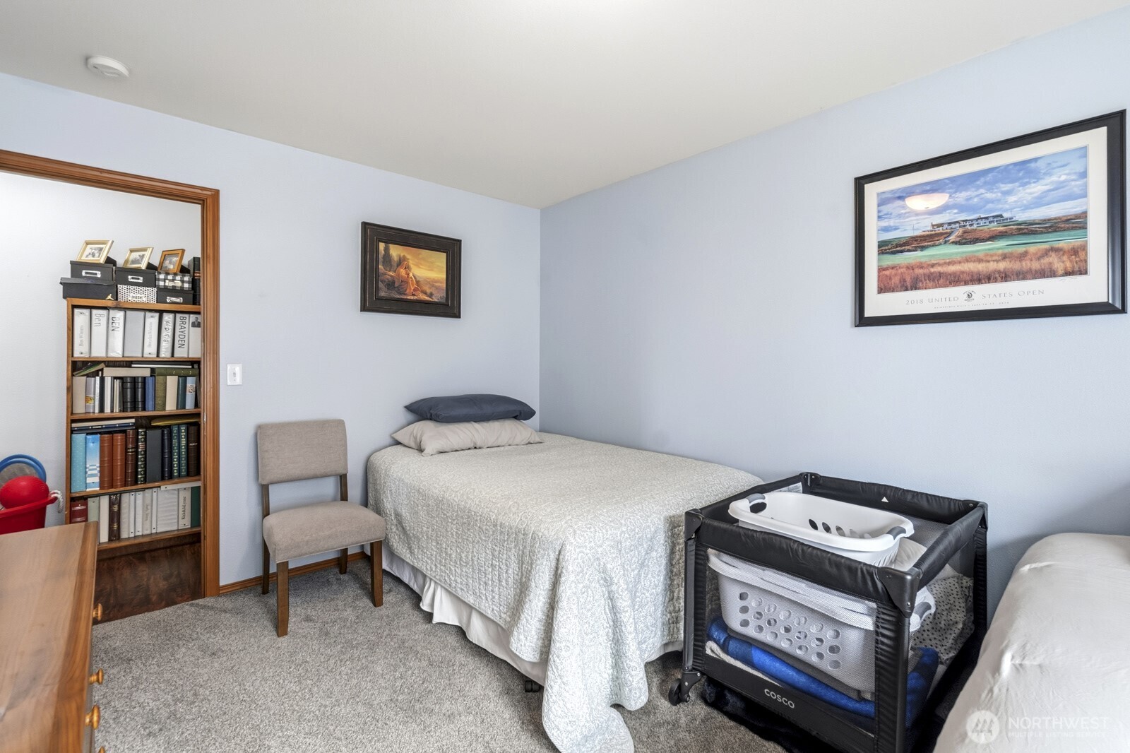1804 Harborview Drive Aberdeen, WA 98520 - Photo 23 of 30 a bedroom with a bed and a bookshelf