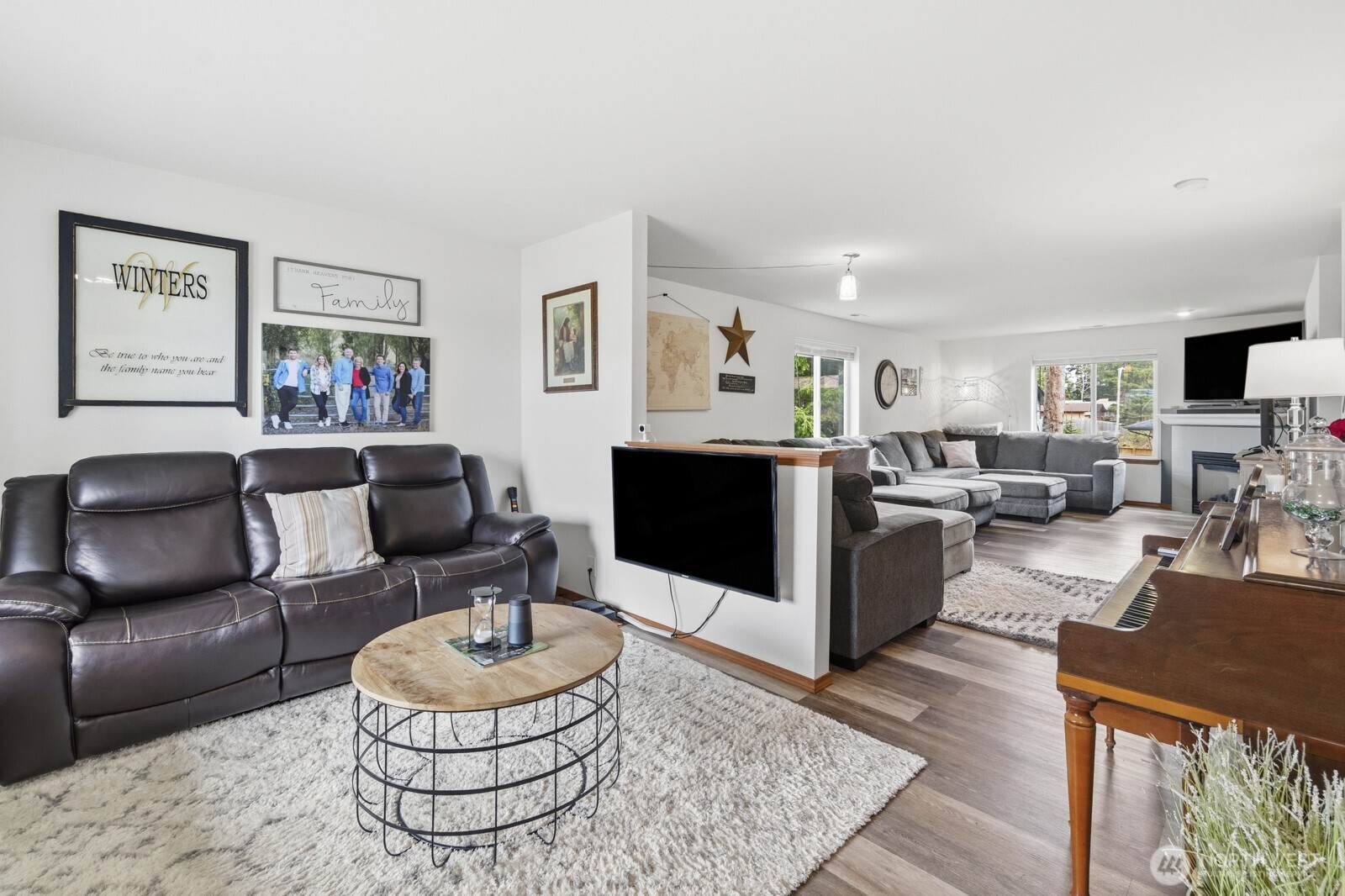 1804 Harborview Drive Aberdeen, WA 98520 - Photo 3 of 30 a living room with furniture a rug and a flat screen tv