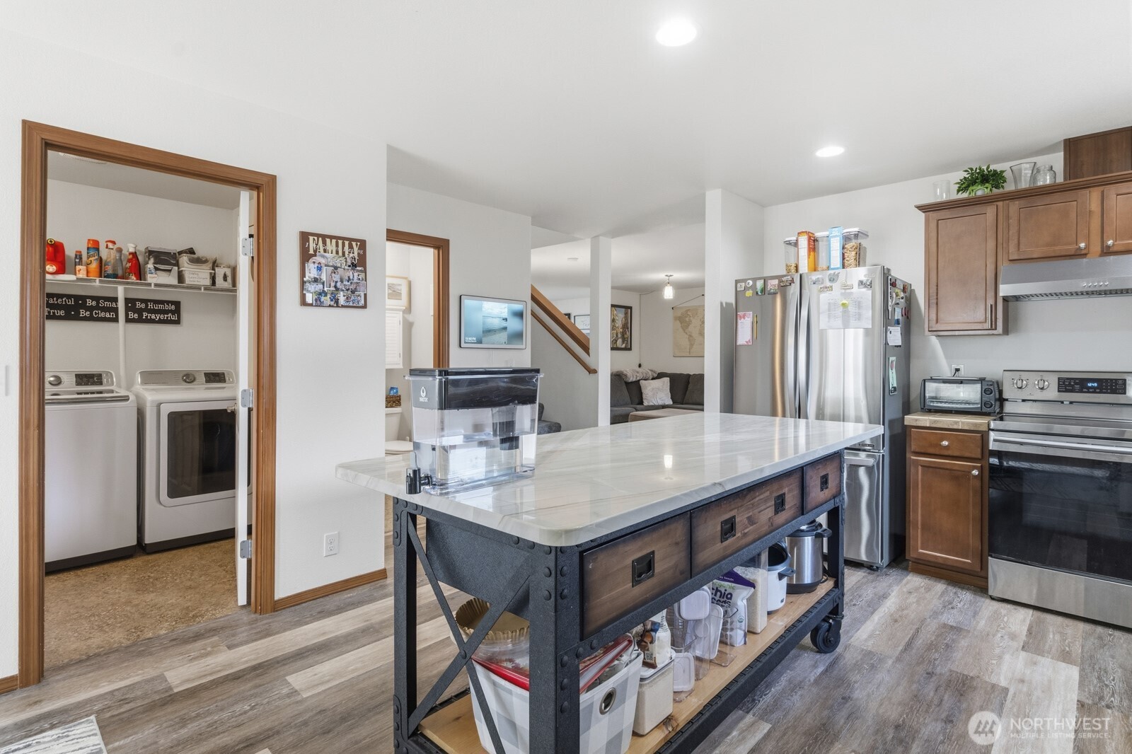 1804 Harborview Drive Aberdeen, WA 98520 - Photo 5 of 30 a kitchen with stainless steel appliances granite countertop a table chairs and a refrigerator