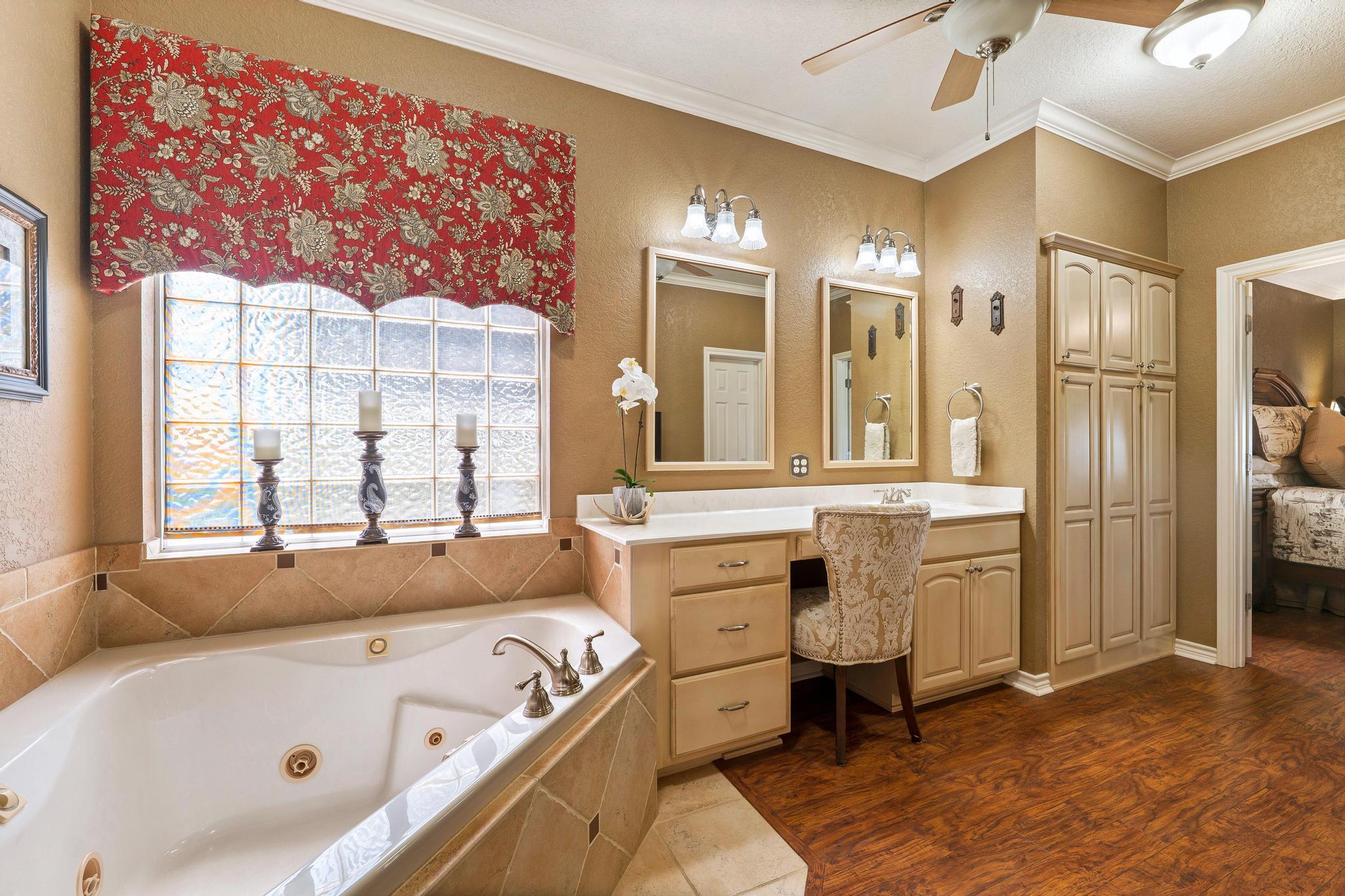 19000 Farm To Market Road 971 Granger, TX 76530 - Photo 20 of 40 The ensuite is equipped with a relaxing jetted tub.