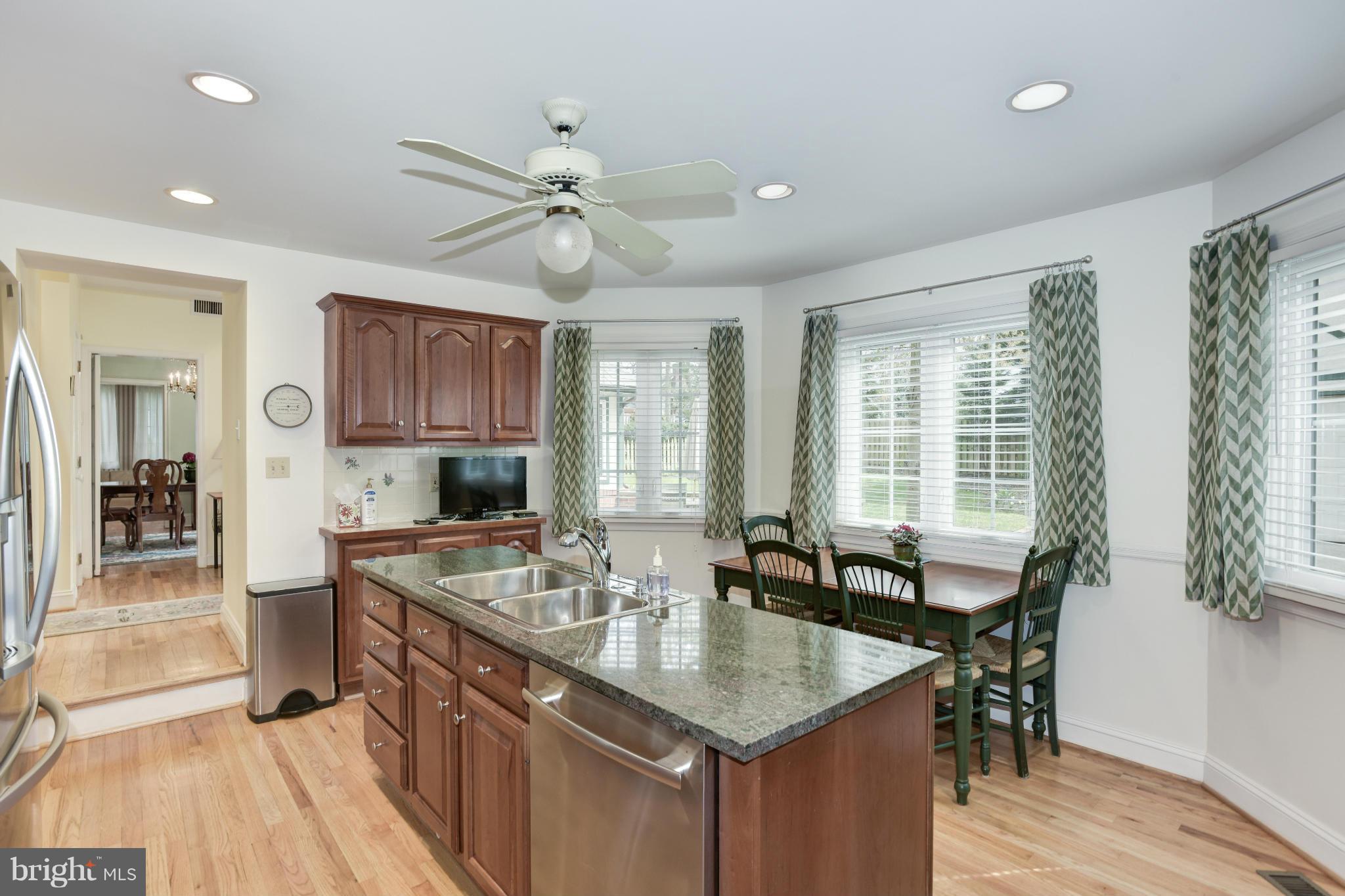 609 Chumleigh Road Baltimore, MD 21212 - Photo 11 of 30 a kitchen with granite countertop lots of counter top space and dining table
