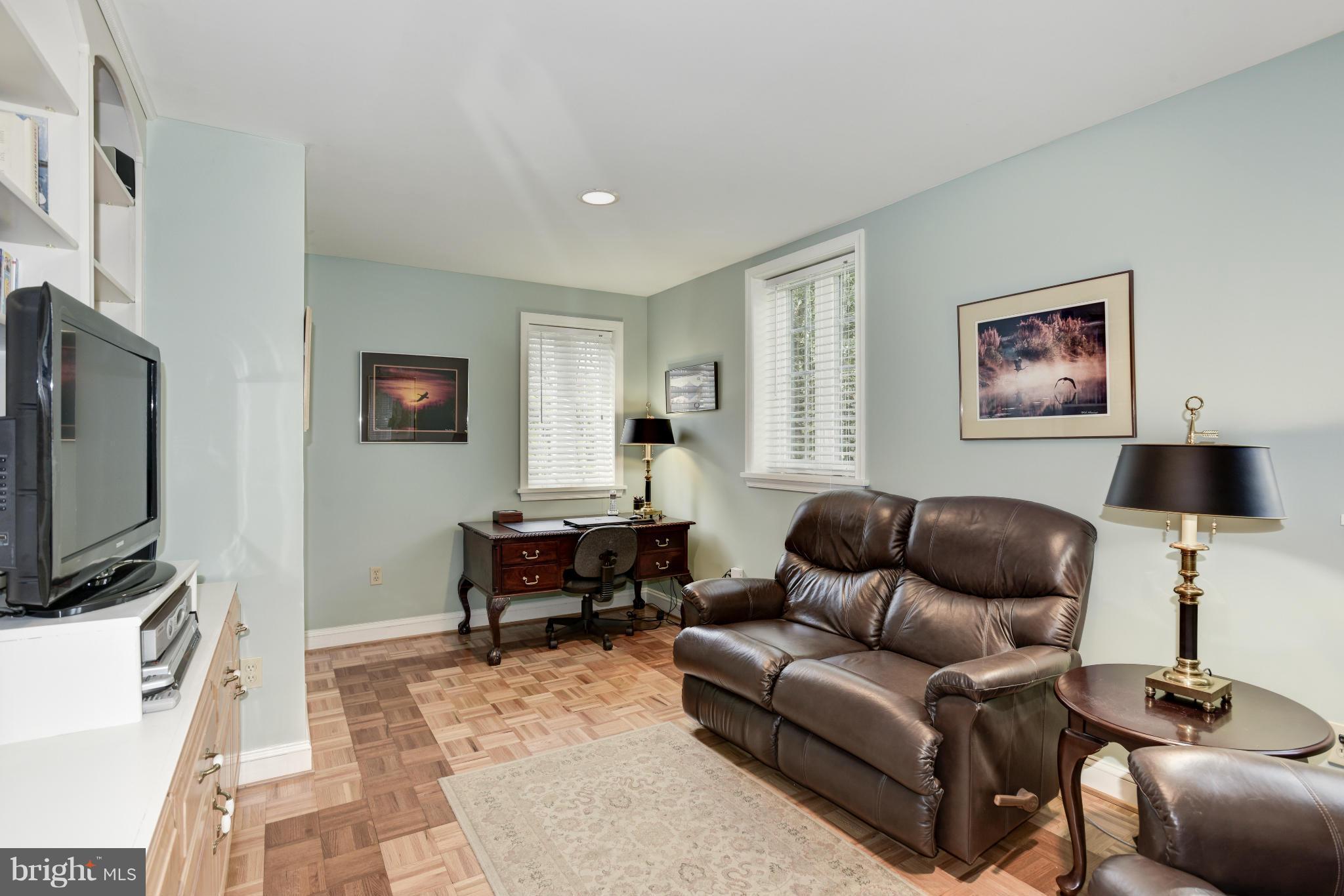 609 Chumleigh Road Baltimore, MD 21212 - Photo 16 of 30 a living room with furniture and a flat screen tv