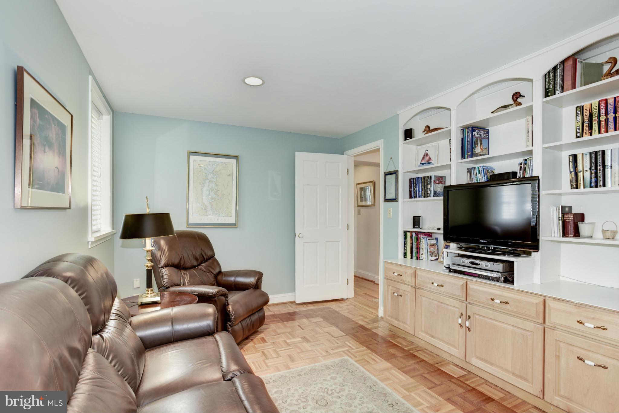 609 Chumleigh Road Baltimore, MD 21212 - Photo 17 of 30 a living room with furniture and a flat screen tv