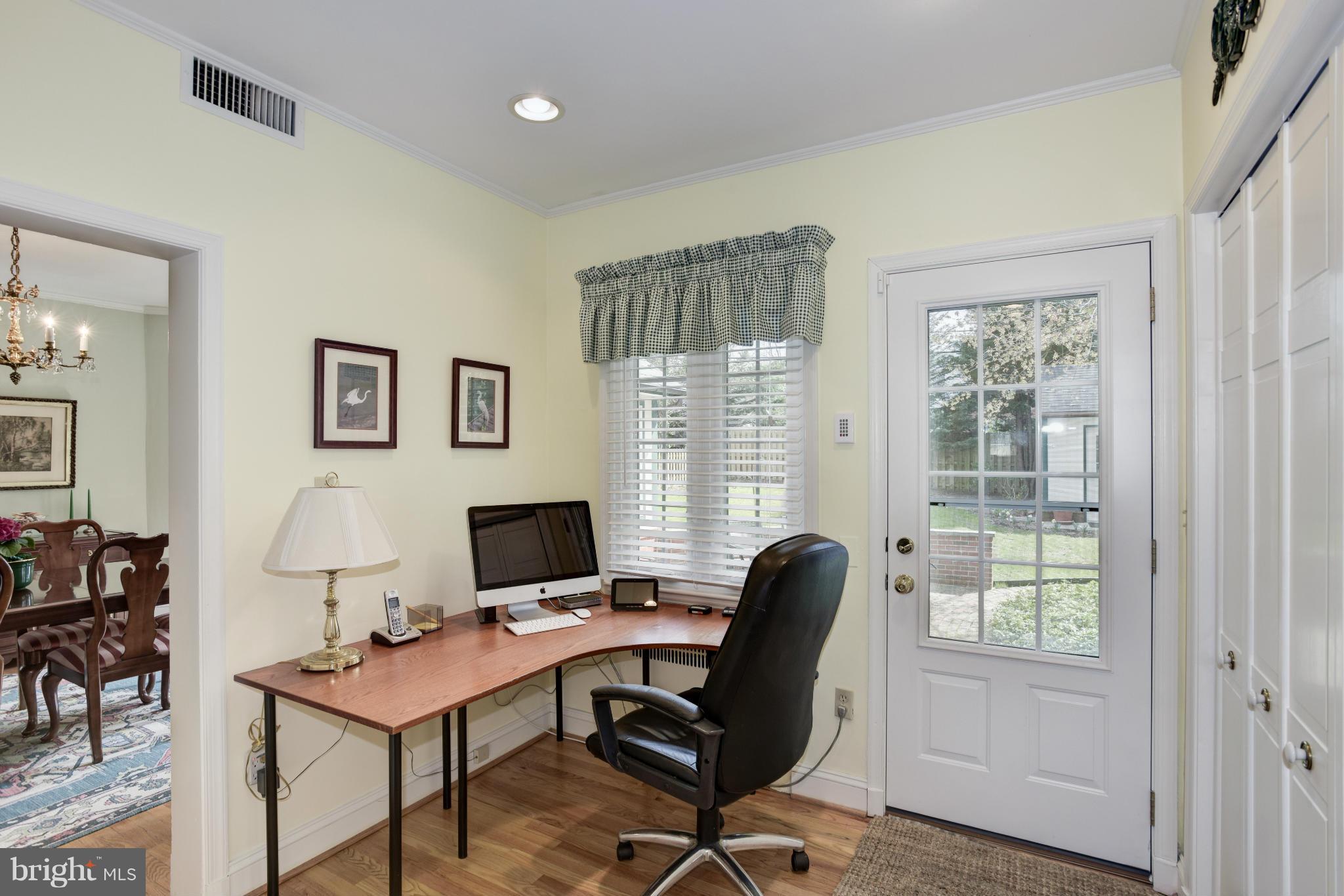 609 Chumleigh Road Baltimore, MD 21212 - Photo 19 of 30 a view of a workspace with furniture and a window