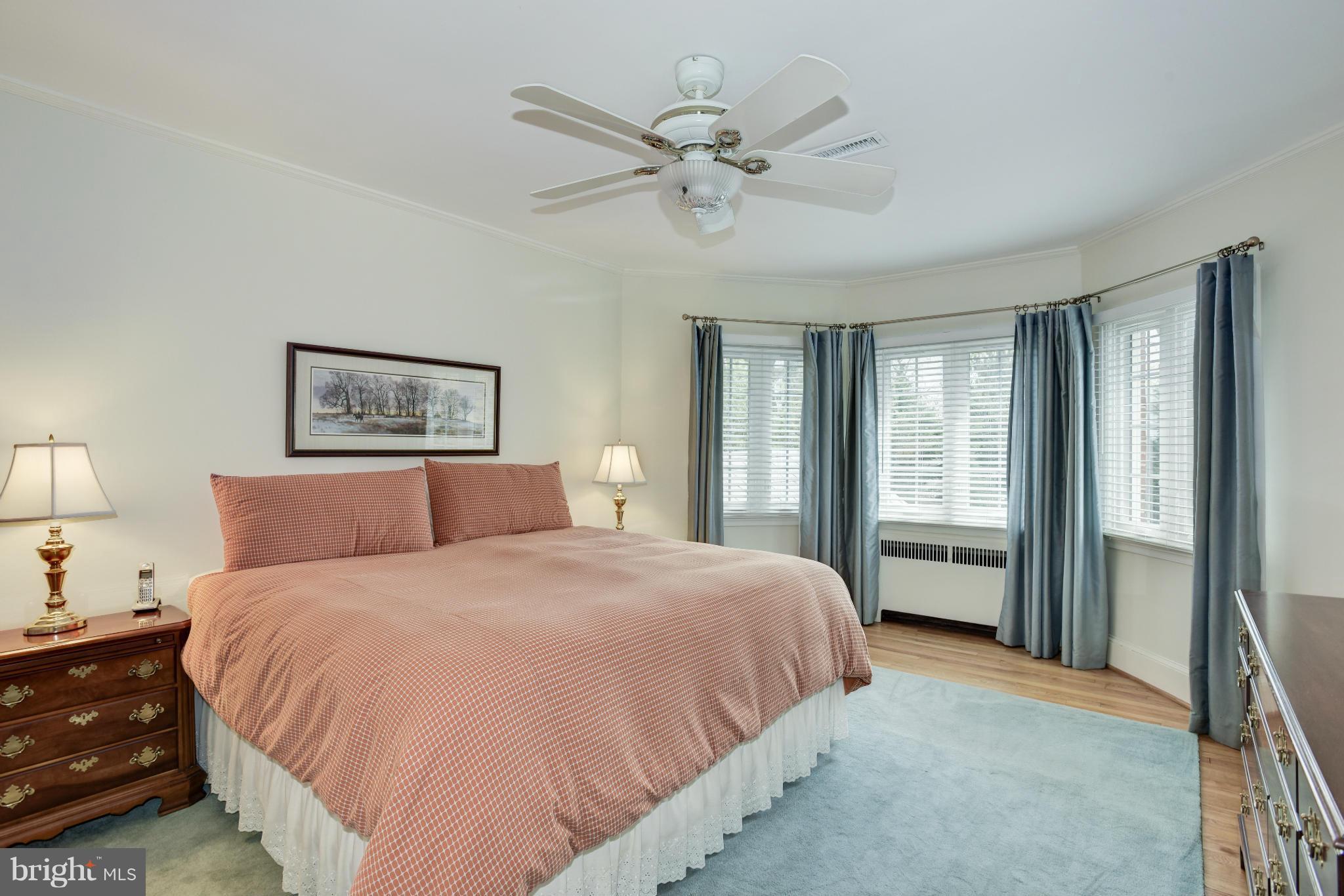 609 Chumleigh Road Baltimore, MD 21212 - Photo 20 of 30 a bedroom with a large bed and a chandelier