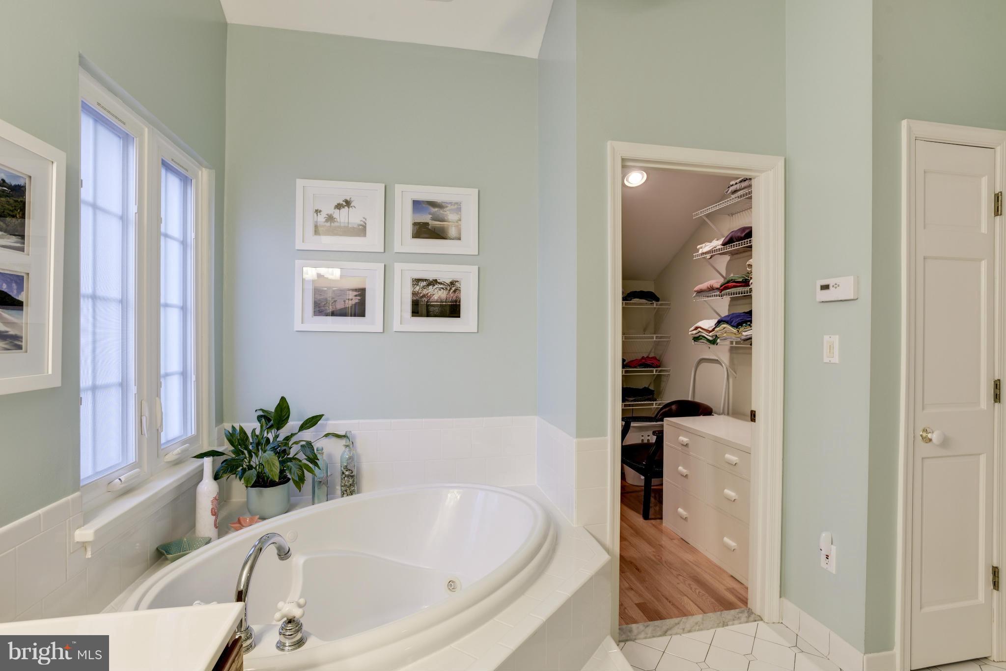 609 Chumleigh Road Baltimore, MD 21212 - Photo 22 of 30 a white bath tub sitting in a bathroom next to a window