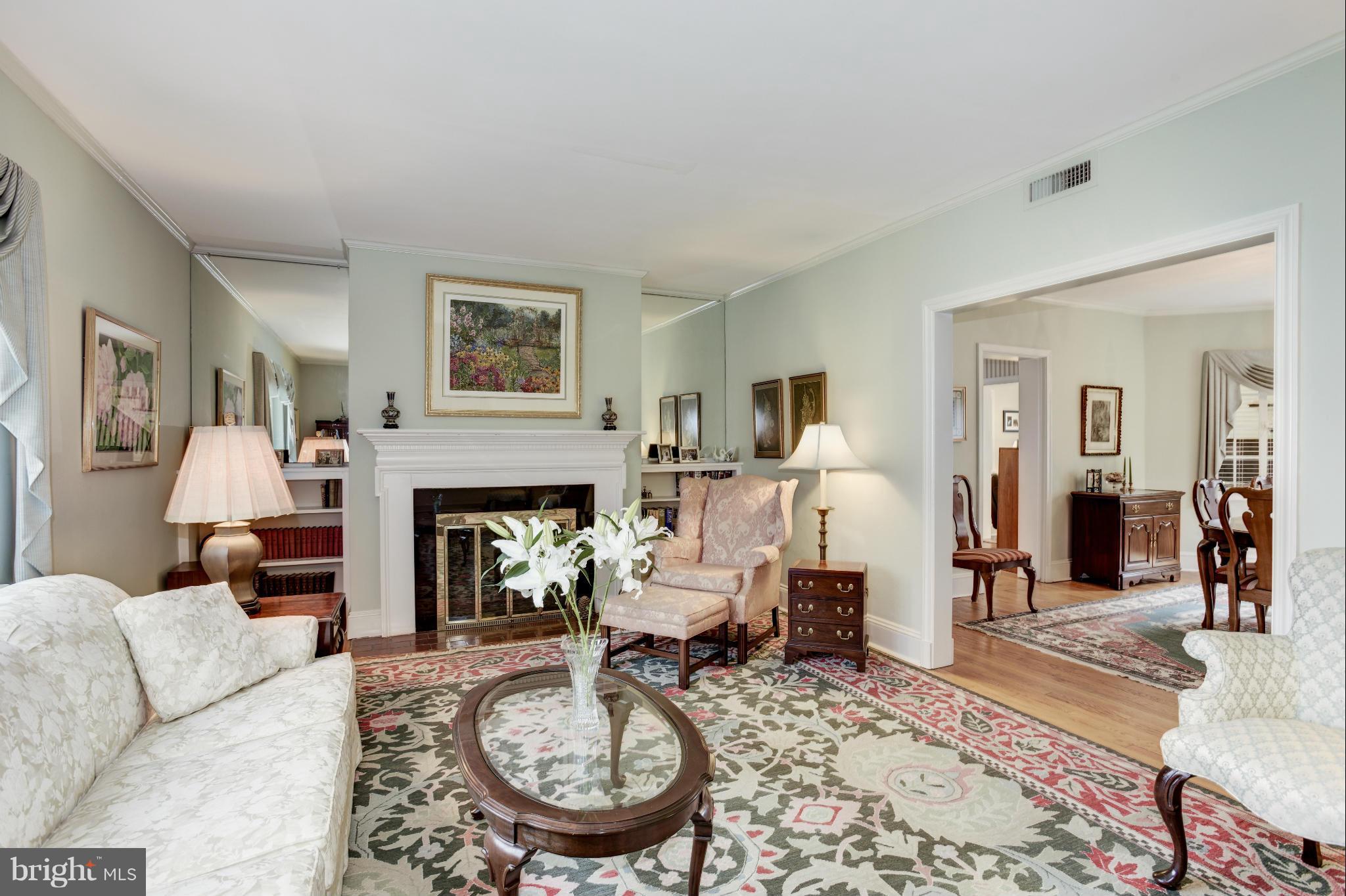 609 Chumleigh Road Baltimore, MD 21212 - Photo 5 of 30 a living room with furniture a fireplace and wooden floor