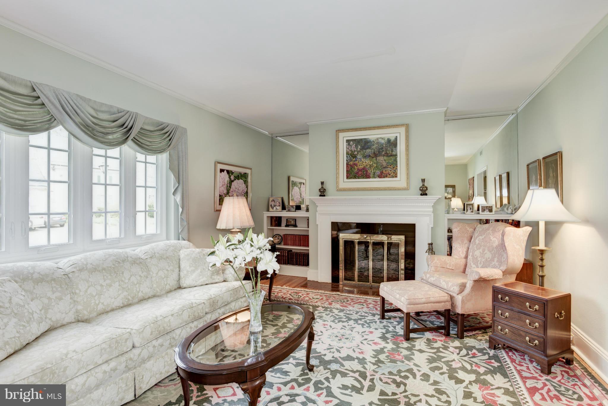 609 Chumleigh Road Baltimore, MD 21212 - Photo 6 of 30 a living room with furniture and a fireplace