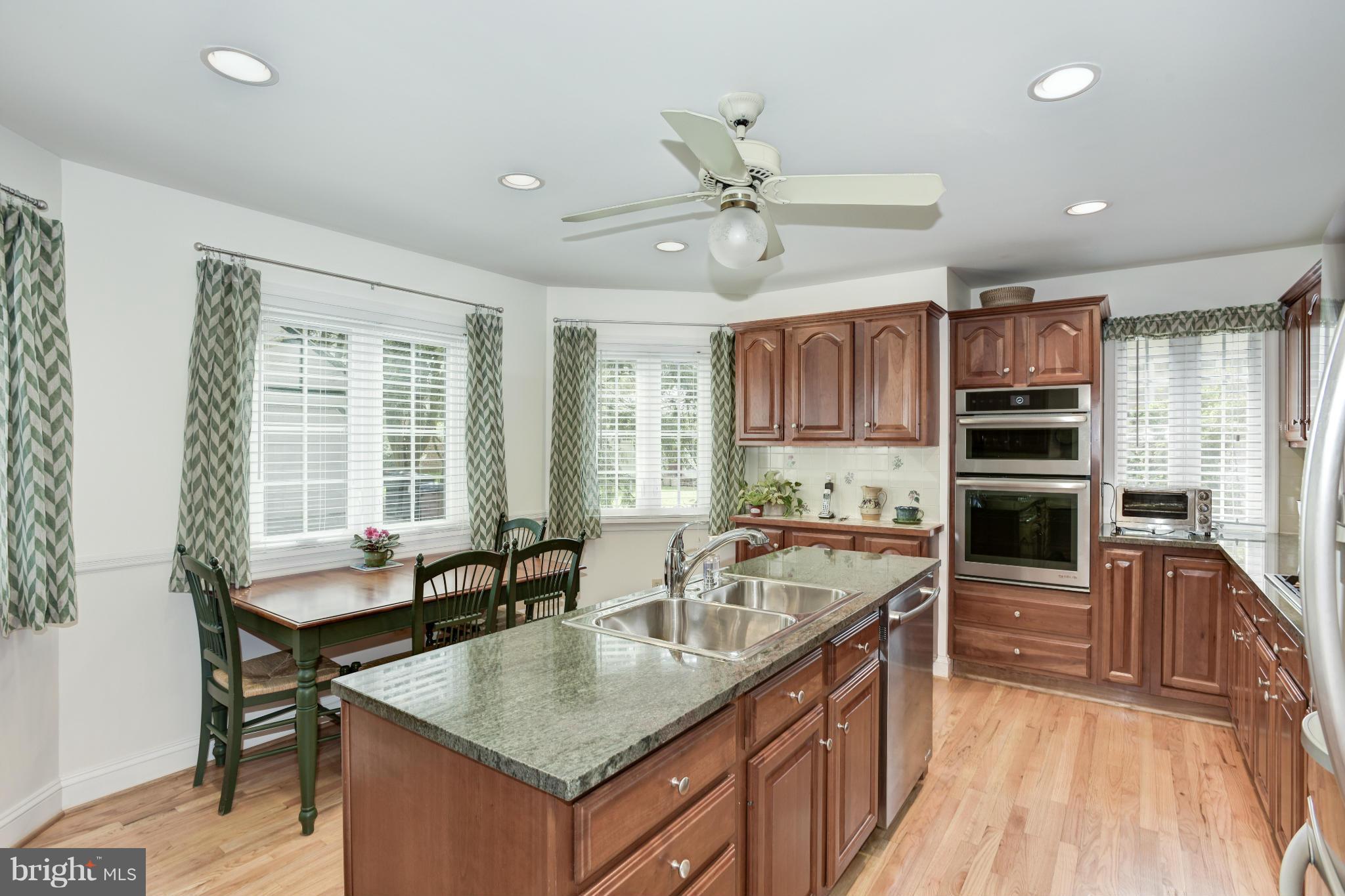 609 Chumleigh Road Baltimore, MD 21212 - Photo 10 of 30 a kitchen with a stove a sink and a refrigerator