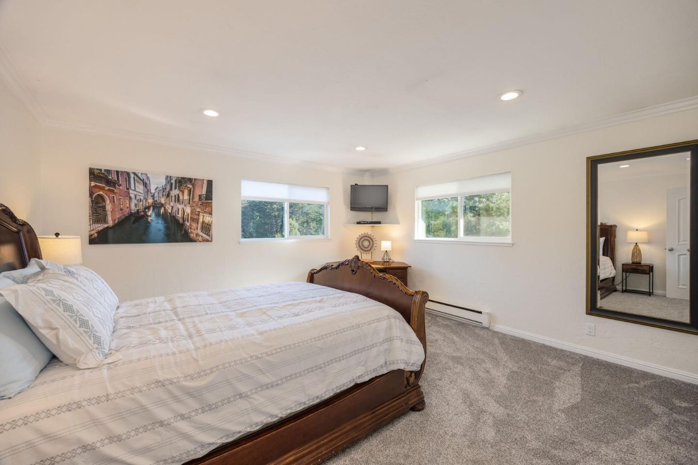 1790 Sunshine Valley Road Moss Beach, CA 94038 - Photo 13 of 30 a spacious bedroom with a large bed and a dresser
