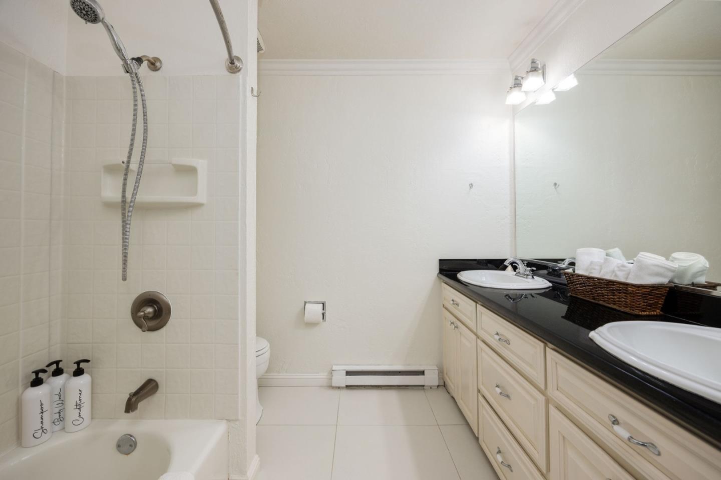 1790 Sunshine Valley Road Moss Beach, CA 94038 - Photo 15 of 30 a bathroom with a double vanity sink toilet and shower
