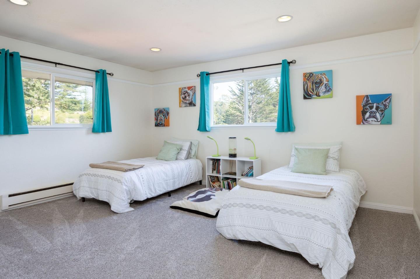 1790 Sunshine Valley Road Moss Beach, CA 94038 - Photo 16 of 30 a spacious bedroom with two beds and a couch