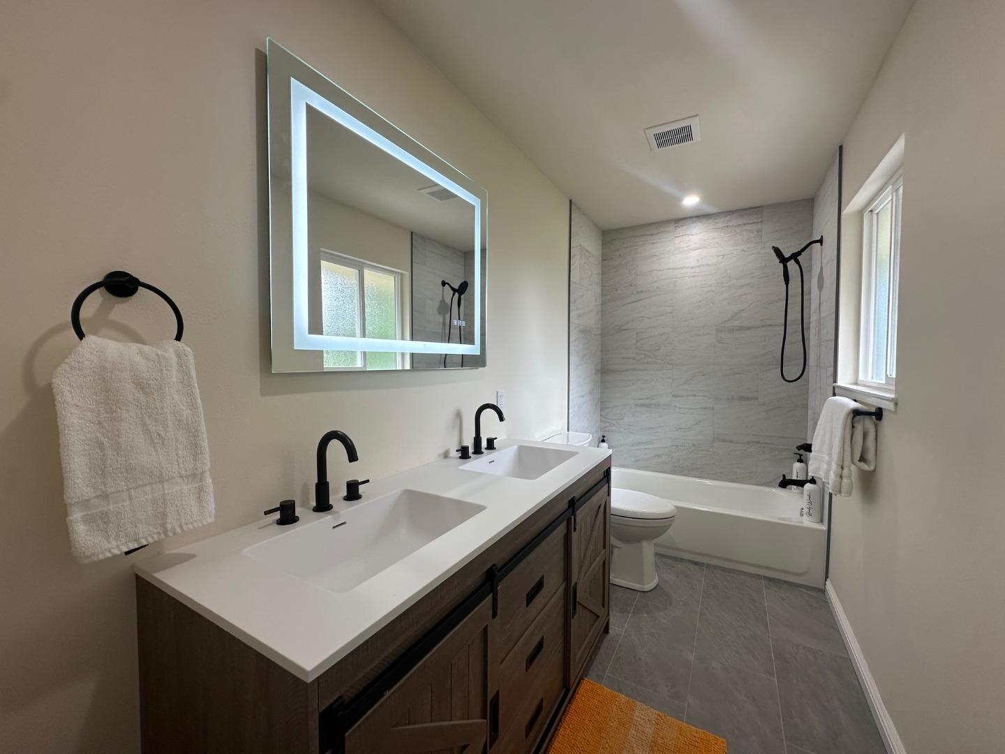 1790 Sunshine Valley Road Moss Beach, CA 94038 - Photo 20 of 30 a bathroom with a sink a toilet and shower