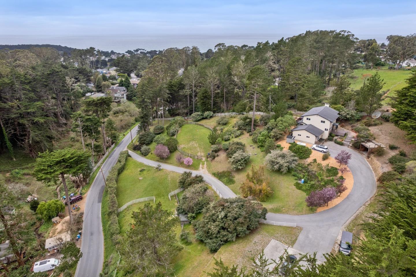 1790 Sunshine Valley Road Moss Beach, CA 94038 - Photo 2 of 30 an aerial view of a house with a yard and lake view