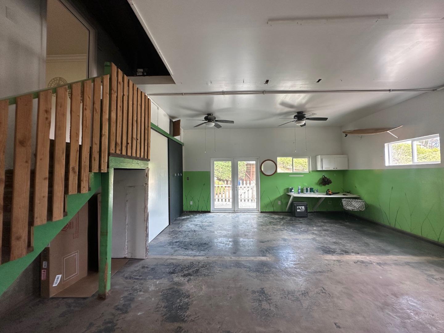 1790 Sunshine Valley Road Moss Beach, CA 94038 - Photo 28 of 30 an empty room with windows and fireplace