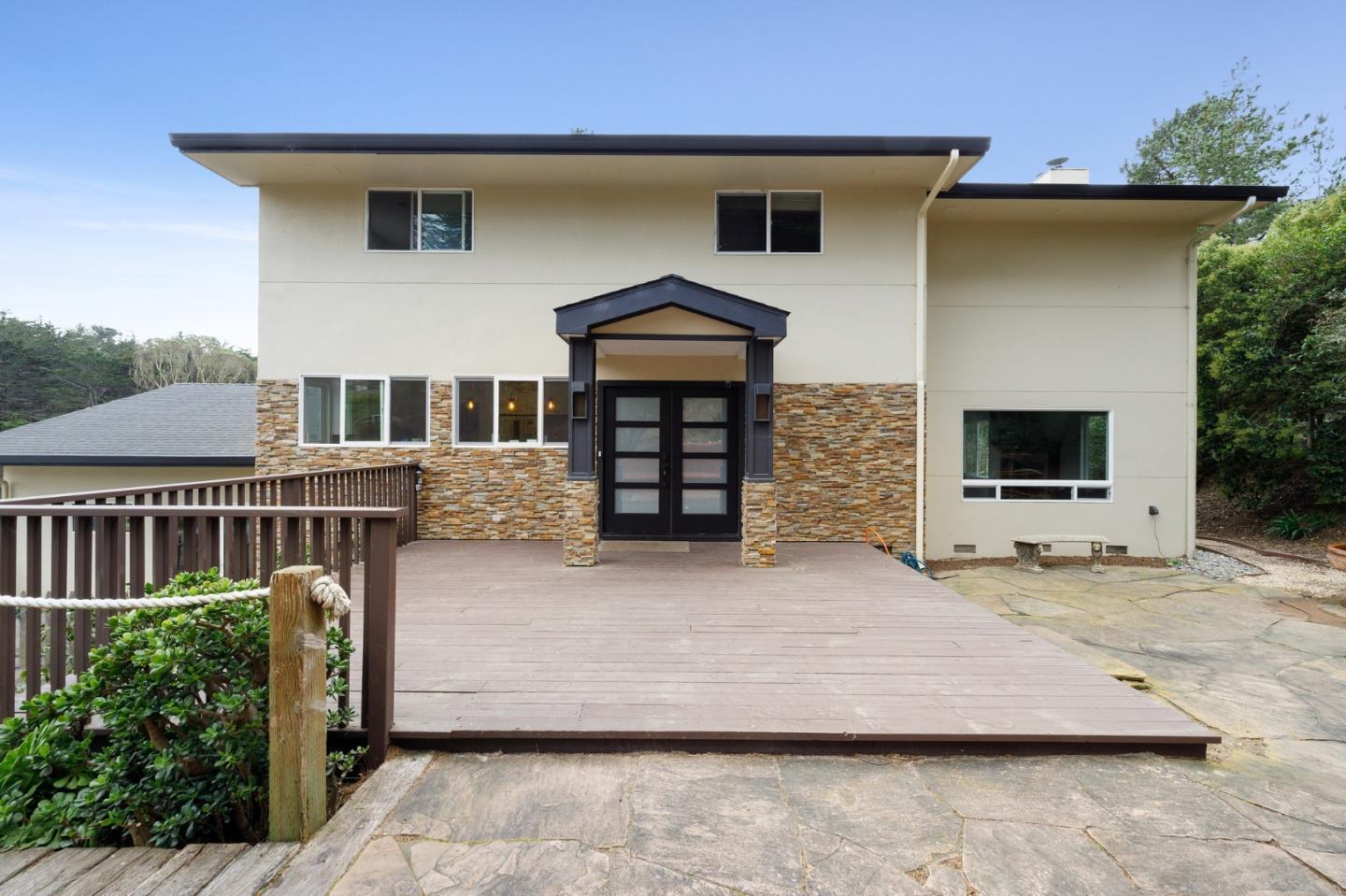 1790 Sunshine Valley Road Moss Beach, CA 94038 - Photo 5 of 30 a front view of a house with stairs