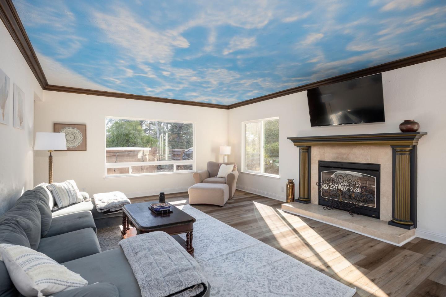 1790 Sunshine Valley Road Moss Beach, CA 94038 - Photo 9 of 30 a living room with furniture and a fireplace