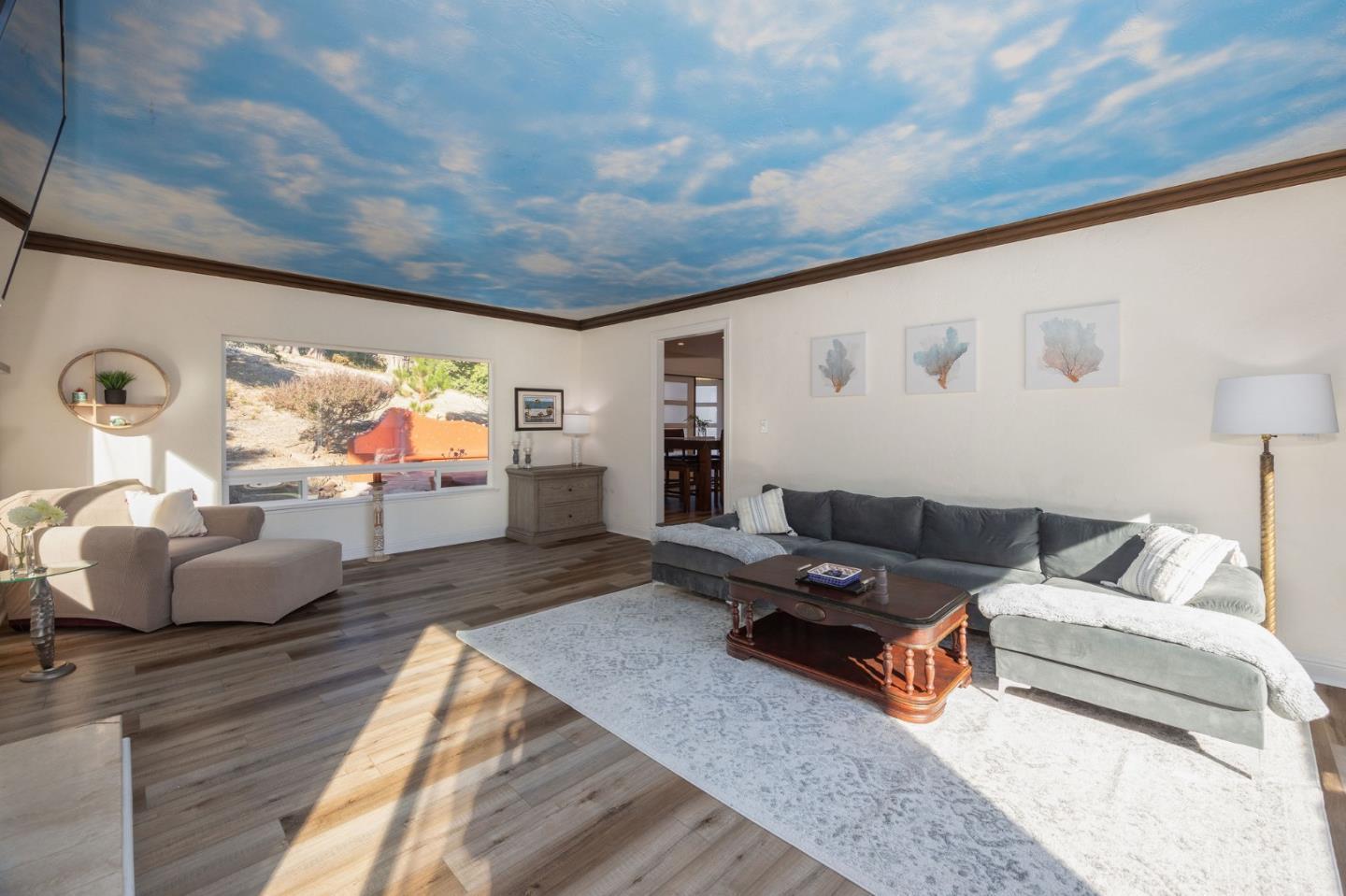 1790 Sunshine Valley Road Moss Beach, CA 94038 - Photo 10 of 30 a living room with furniture and a flat screen tv