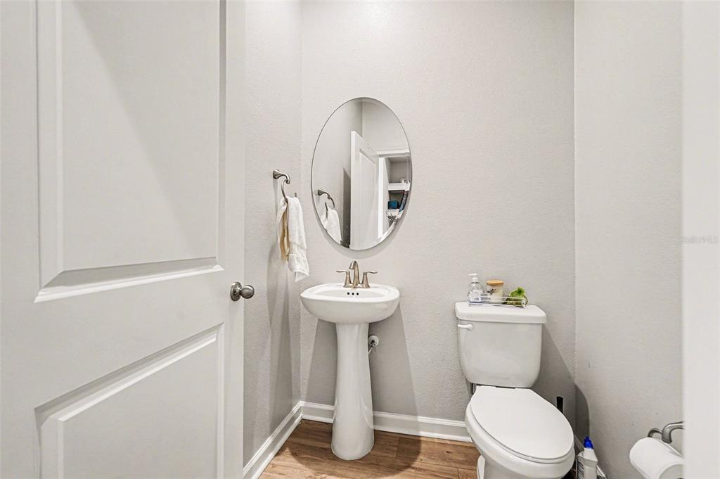 2361 Summerlit Street Lutz, FL 33558 - Photo 12 of 31 a bathroom with a toilet sink and mirror