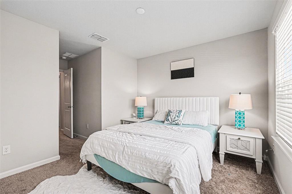 2361 Summerlit Street Lutz, FL 33558 - Photo 21 of 31 a bedroom with a bed and a window