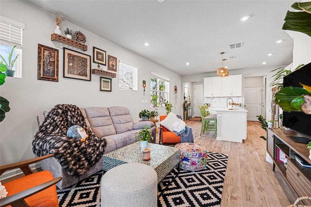 2361 Summerlit Street Lutz, FL 33558 - Photo 5 of 31 a living room with furniture and a flat screen tv