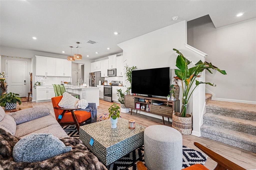 2361 Summerlit Street Lutz, FL 33558 - Photo 7 of 31 a living room with furniture and a flat screen tv