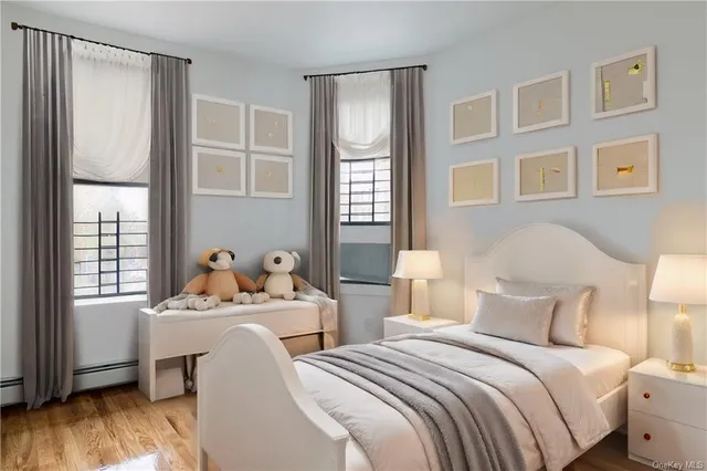 a bedroom with two beds and windows