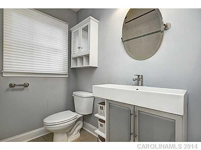 5525 Valley Forge Road Charlotte, NC 28210 - Photo 14 of 16 a bathroom with a sink mirror and toilet