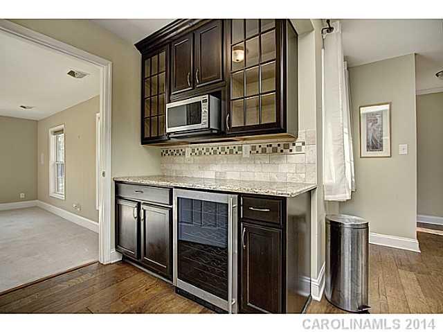 5525 Valley Forge Road Charlotte, NC 28210 - Photo 8 of 16 a kitchen with cabinets and stainless steel appliances