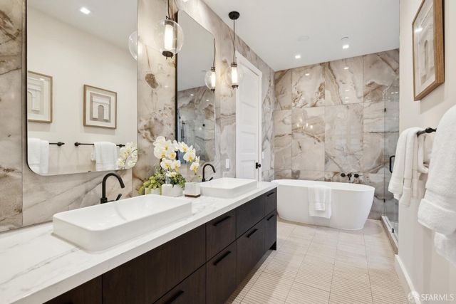 a view of a dining room with furniture and a window