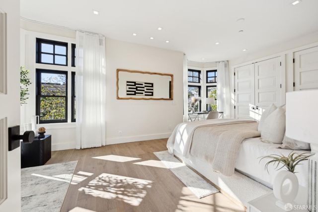 a bed room with a bed and a painting