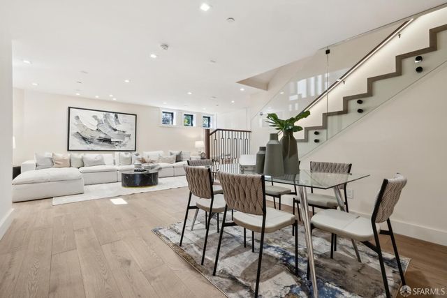 a front view of a house with potted plants