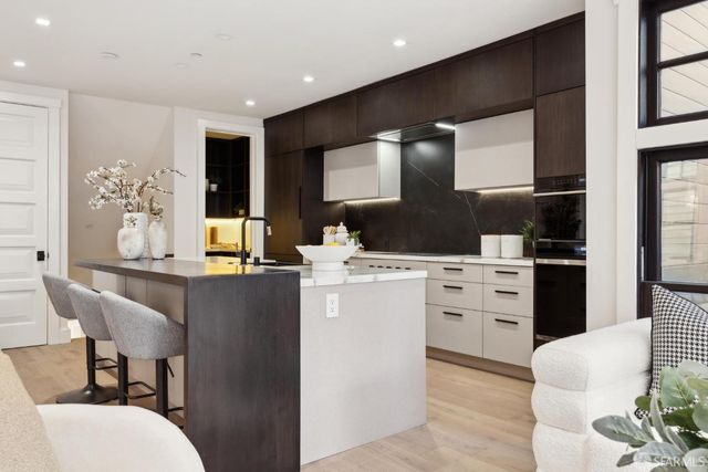 a open kitchen with stainless steel appliances granite countertop a stove and cabinets