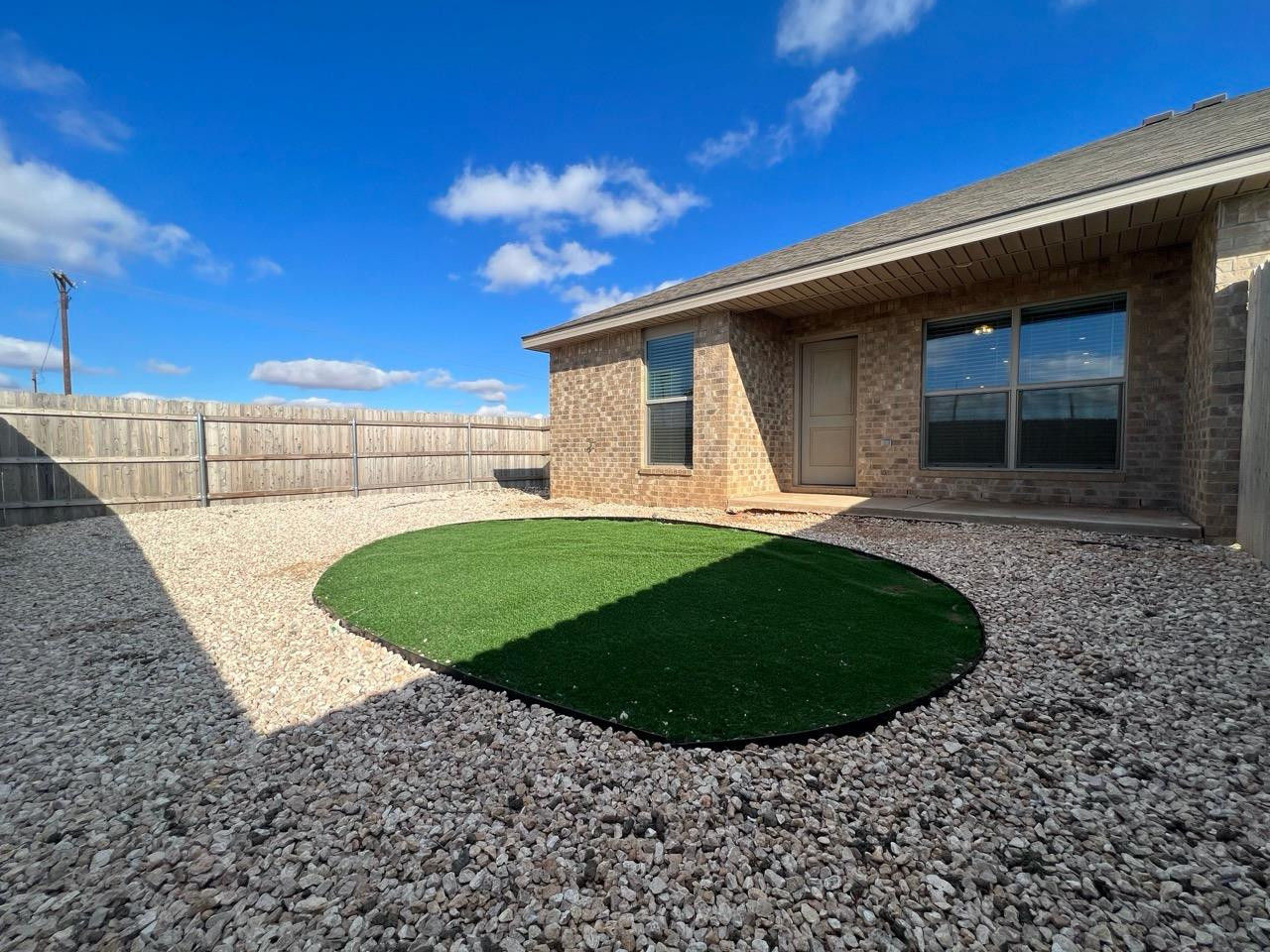 2121 North Avenue J, Unit A Lubbock, TX 79403 - Photo 20 of 20 a view of a backyard with a garden