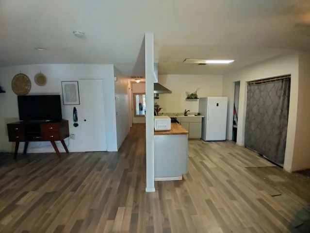a view of kitchen with furniture and wooden floor