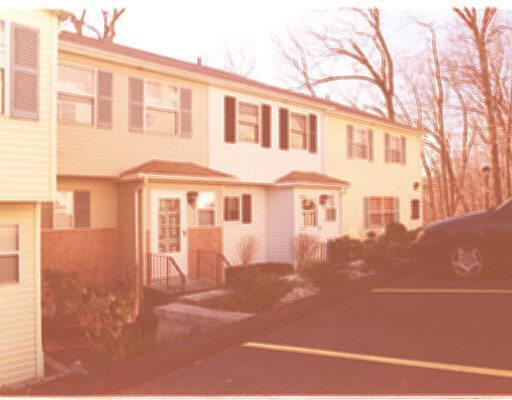25 Padanaram Road, Unit 97 Danbury, CT 06811 - Photo 1 of 1 a front view of a house with a yard