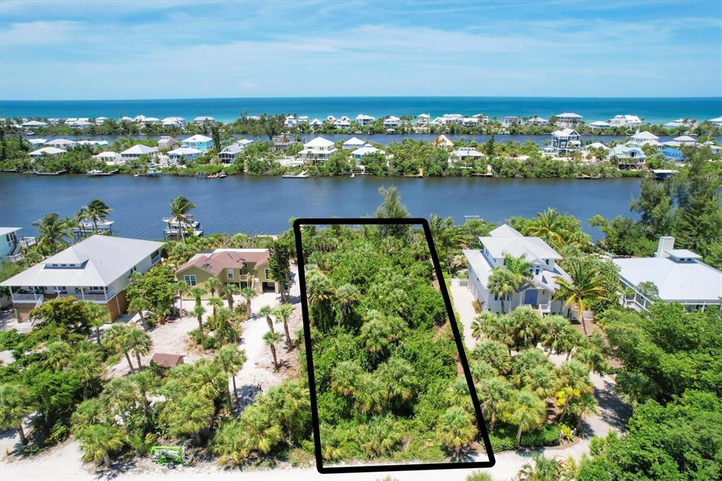 211 Kettle Harbor Drive Placida, FL 33946 - Photo 1 of 14 an aerial view of residential houses with outdoor space and ocean view
