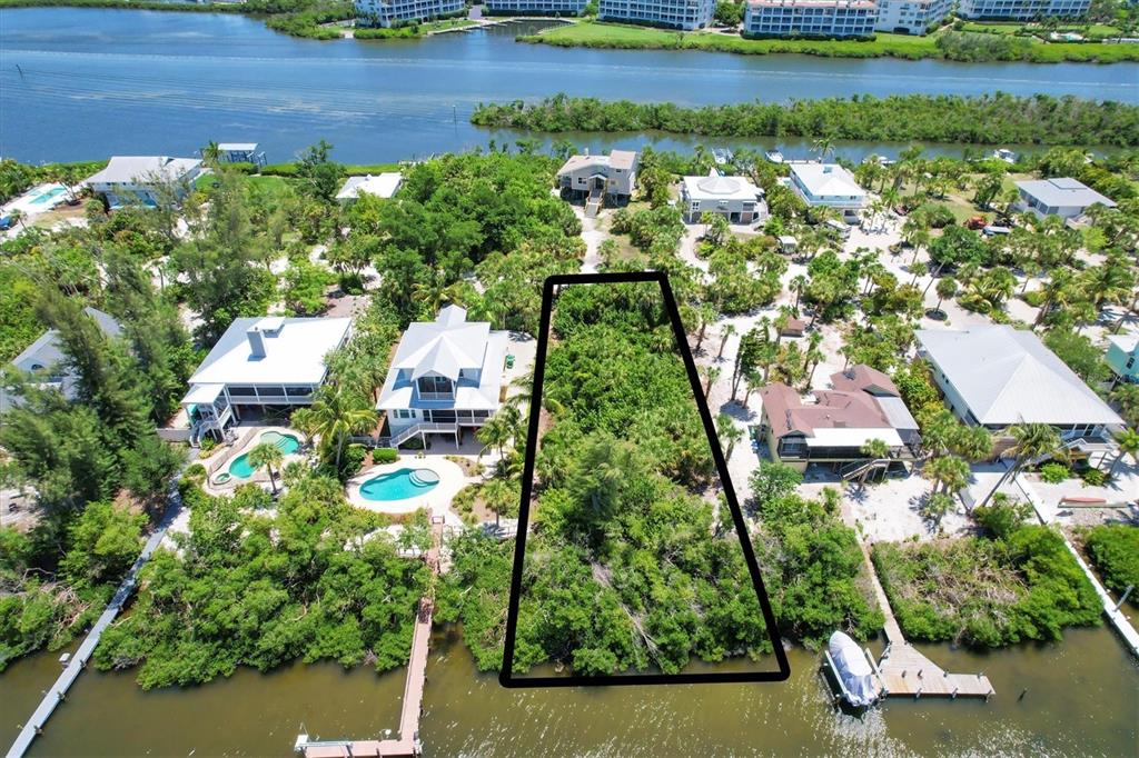 211 Kettle Harbor Drive Placida, FL 33946 - Photo 14 of 14 an aerial view of residential houses with outdoor space and trees