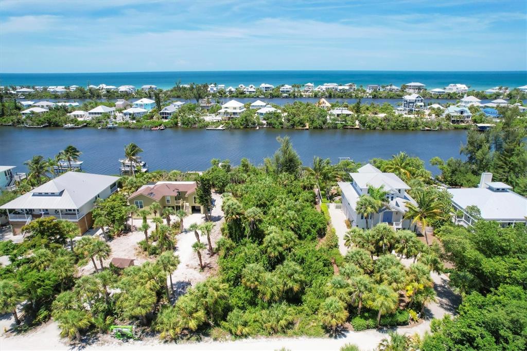211 Kettle Harbor Drive Placida, FL 33946 - Photo 4 of 14 an aerial view of residential building with outdoor space and trees all around