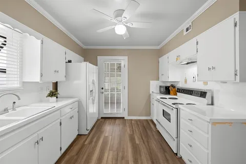 a spacious bedroom with a bed and a window