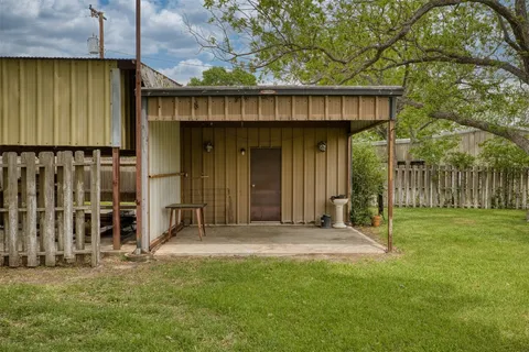 a view of a tree in front of a house