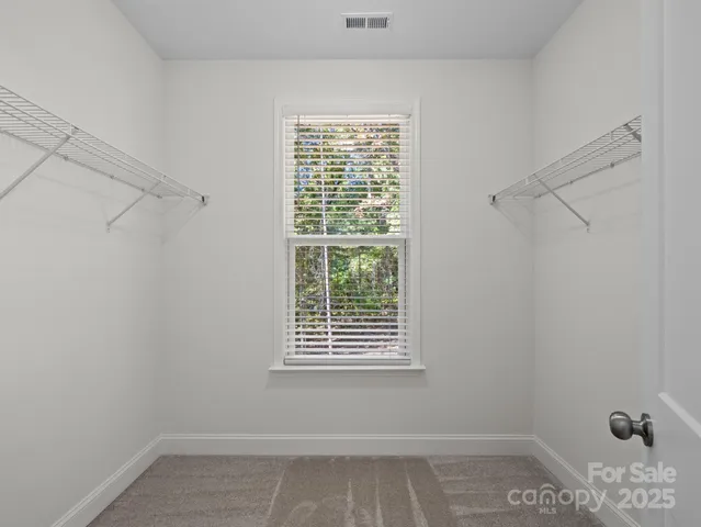 a view of a room that has a window in it