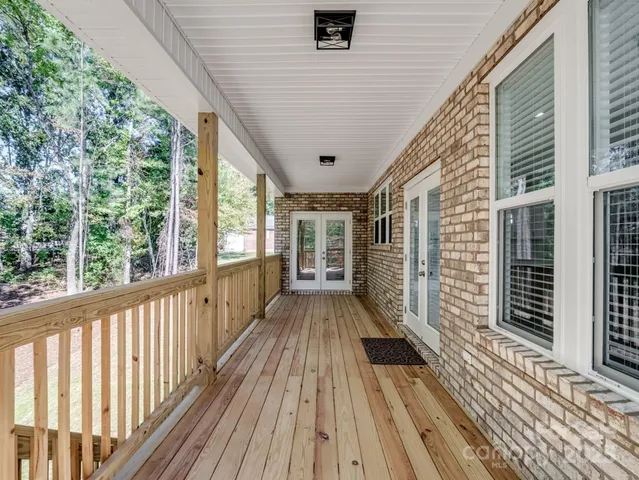 a view of balcony with wooden floor