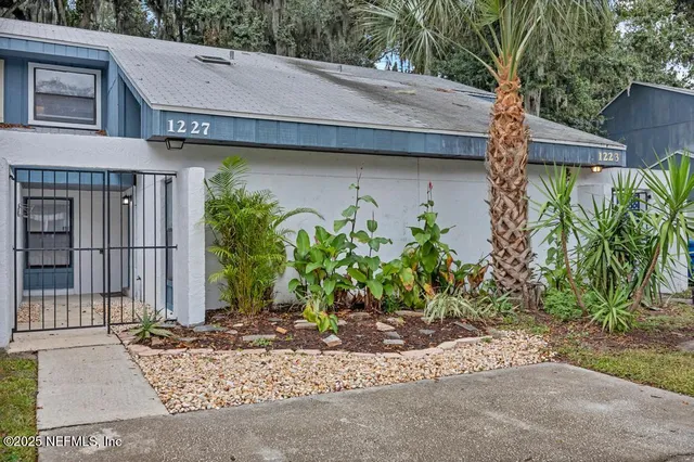 a view of a house with a garden