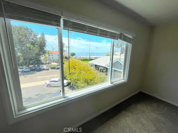 a view of a room that has a large window