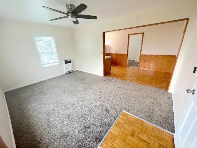 a view of kitchen with furniture and wooden floor