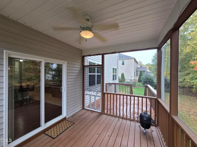 a view of a balcony with wooden floor