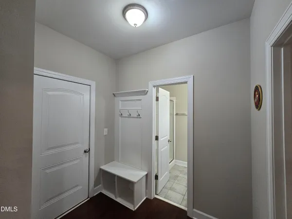a bathroom with a shower and a sink