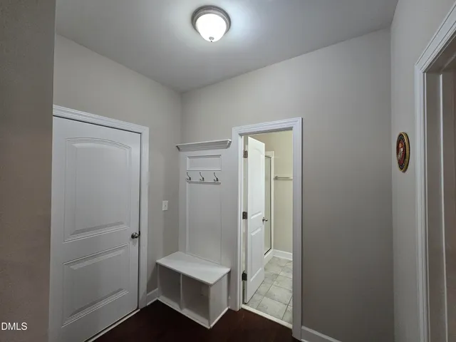 a bathroom with a shower and a sink